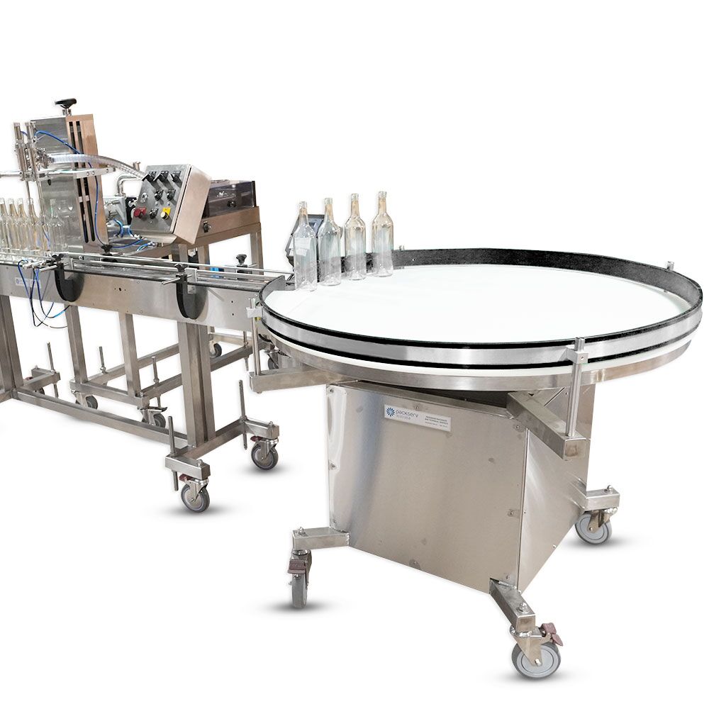 PAT-8 Accumulation Outfeed Table connected to a conveyor system in a packaging line by Packserv Australia.