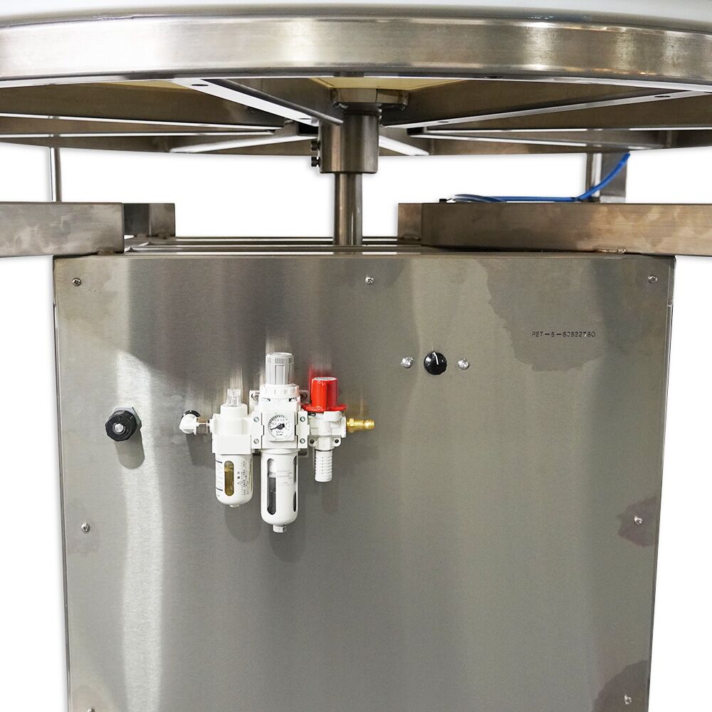 Pneumatic sorting table used for manufacturing by Packserv, featuring a stainless steel surface and adjustable guide rails.